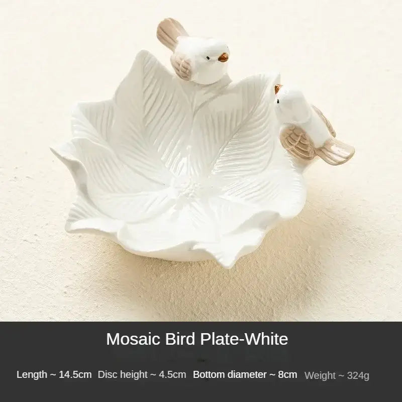 White ceramic flower-shaped jewelry tray with bird figurines, labeled Mosaic Bird Plate-White, for elegant vanity decor.