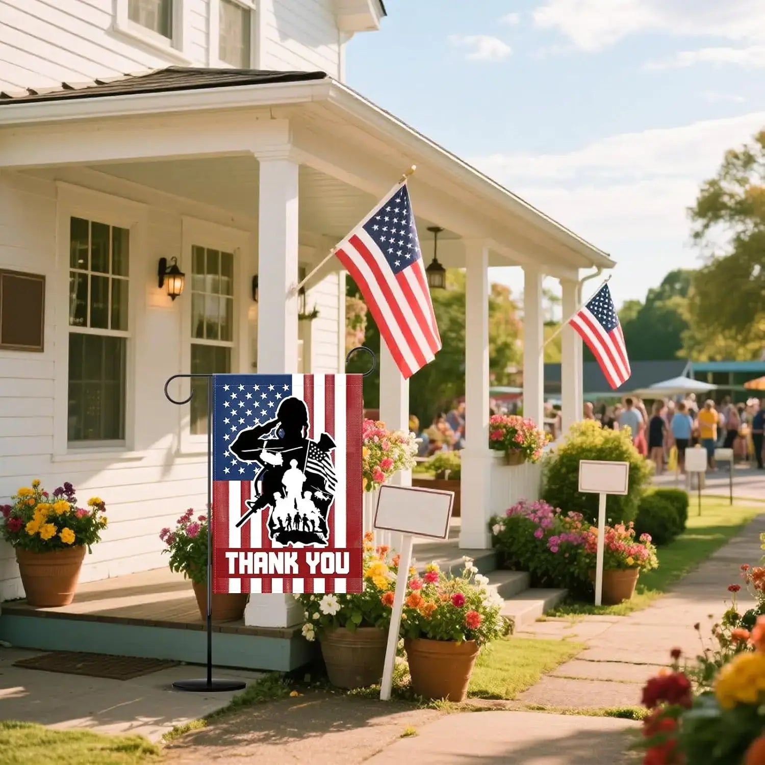 Patriotic Garden Flag 12x18 for Memorial Day displayed on a porch with American flags and flowers, ideal for outdoor holiday decoration.