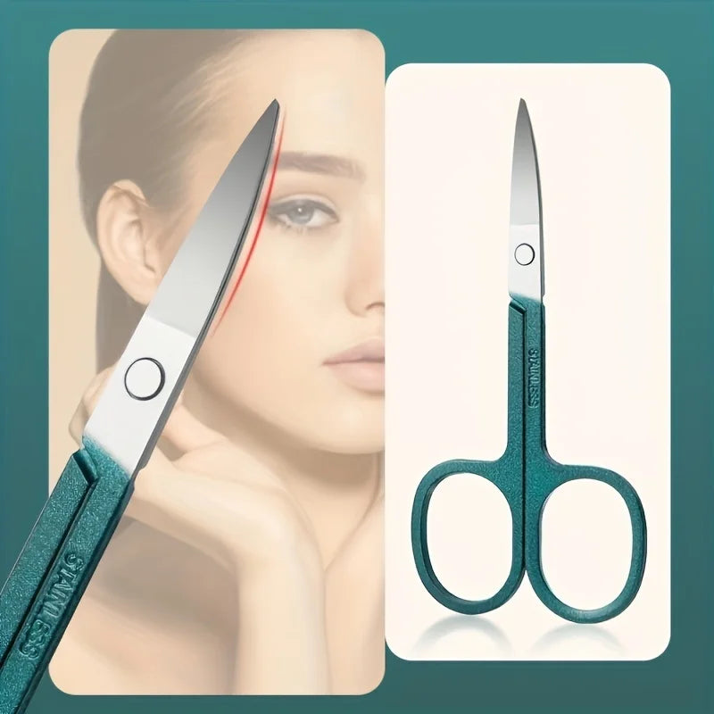 Detail of eyebrow scissors from Nail Care Kit Stainless Steel - Portable Set. Sharp, curved blades for precise grooming and shaping.