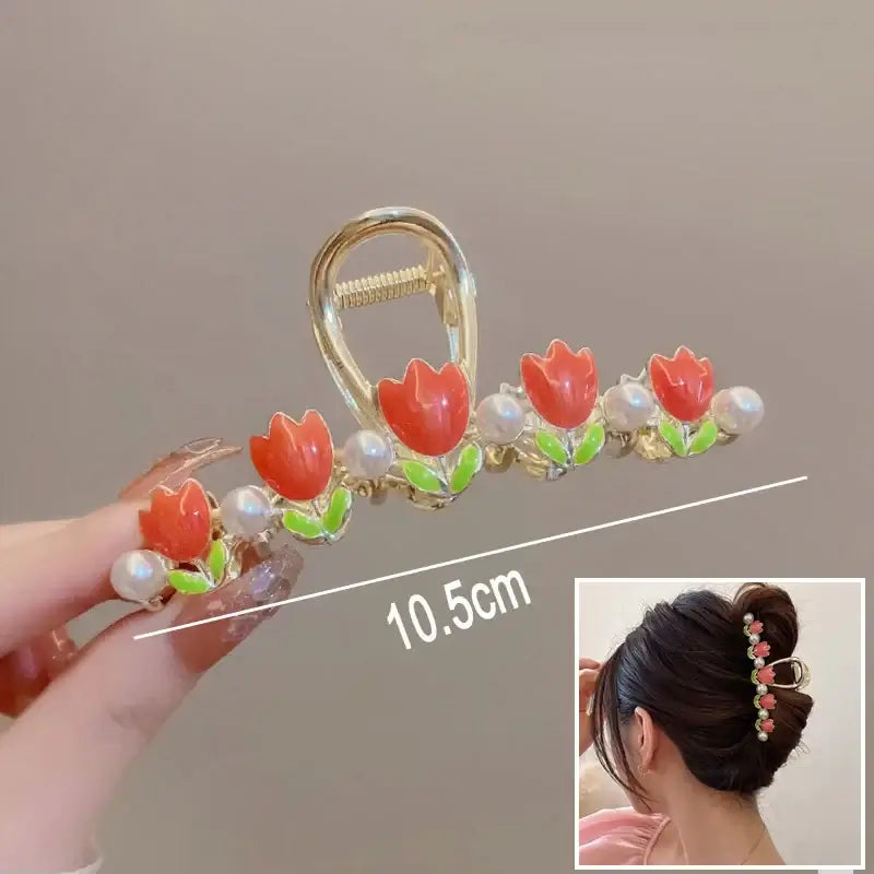 Red tulip ponytail hair clip with pearl accents, 10.5cm long, offering a secure hold and floral charm for updos.
