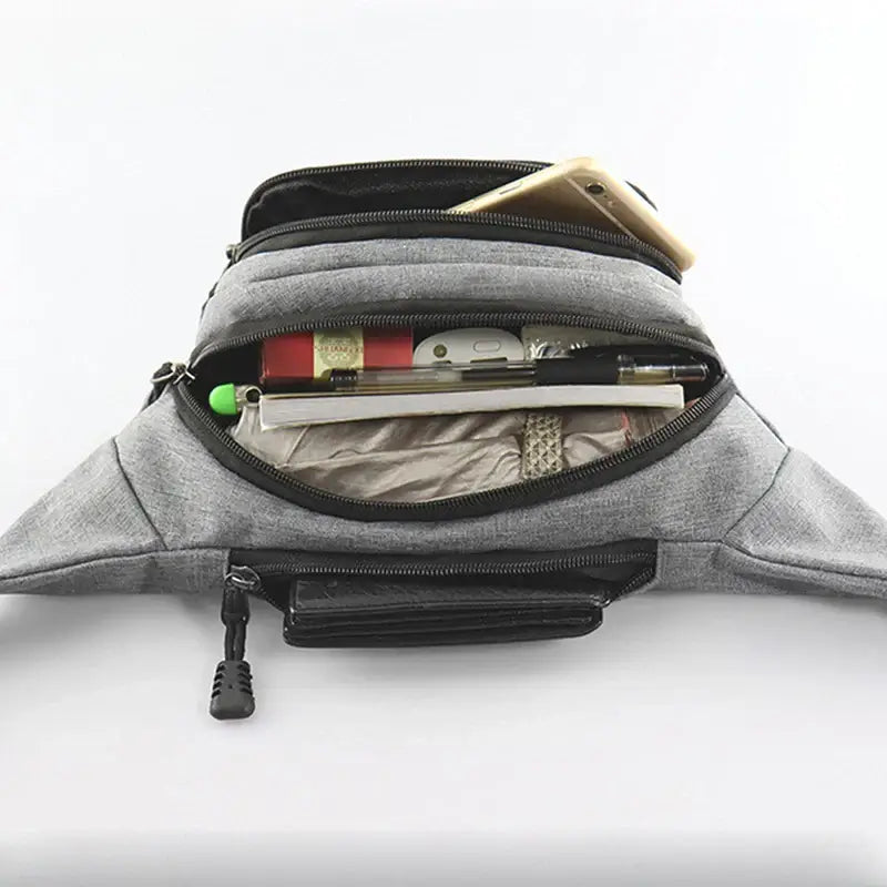 Open gray fanny bag waist pack displaying organized compartments for phone, pens, and wallet for daily use.