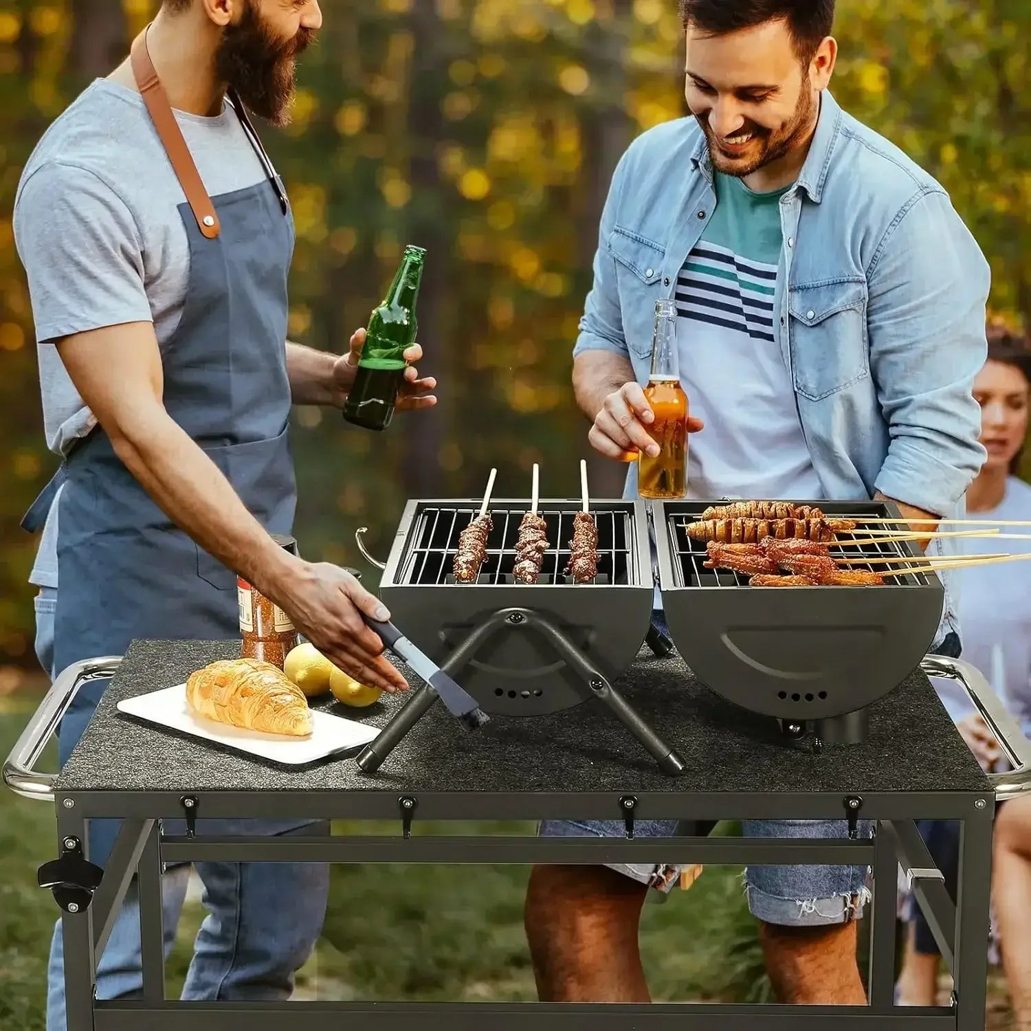 Two men grilling skewers on an outdoor grill table with storage and grill mats, ideal for backyard gatherings and patio barbecues.