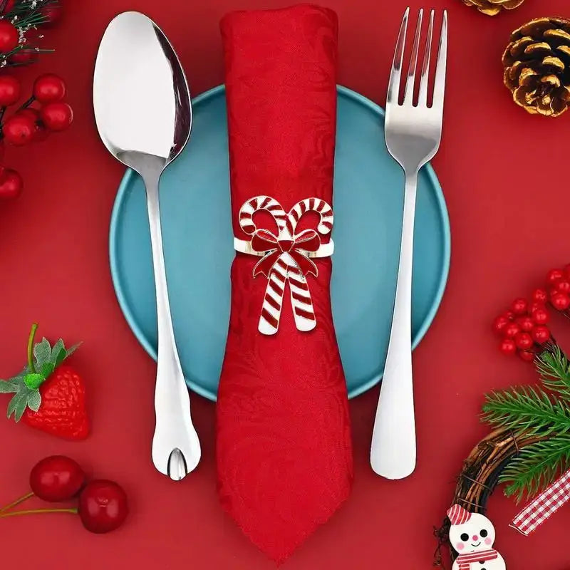 Candy Cane Napkin Rings - Christmas Napkin Holders on red napkin with silverware, ideal for holiday table settings and festive dinners.