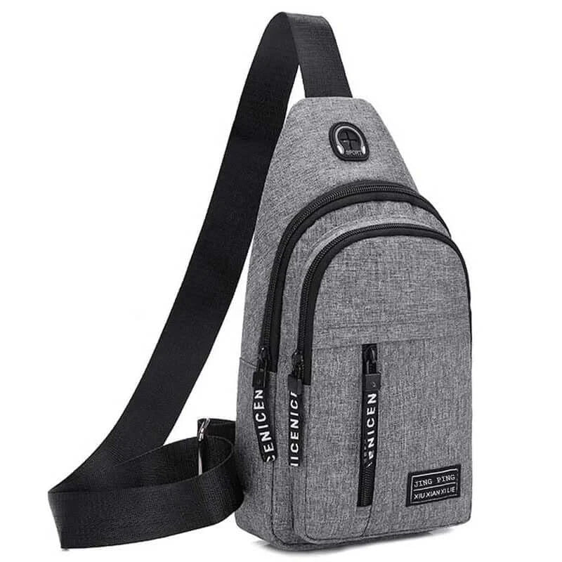Gray multifunctional crossbody shoulder bag with sleek design and branded zipper pulls, combining fashion with functionality.