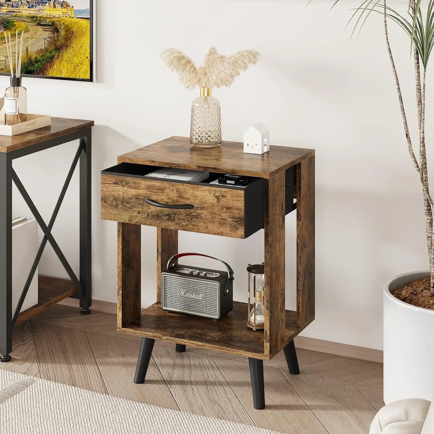 Rustic nightstand with drawer open, showcasing storage space and decor items. Ideal for bedrooms needing stylish and practical furniture.
