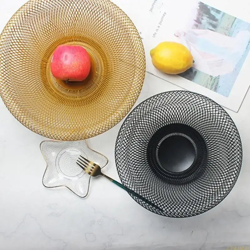 Top view of gold and black metal fruit bowls, perfect for organizing fruits in a stylish and functional kitchen setting.