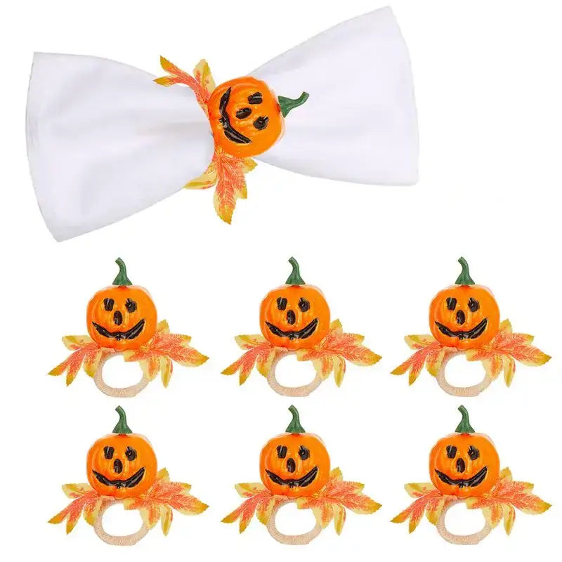 Halloween Pumpkin Napkin Rings Set of 6 with smiling jack-o'-lanterns, orange leaves, and wooden rings for festive table decor.