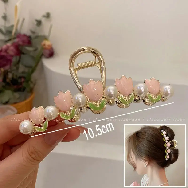 Light pink tulip ponytail hair clip with pearl accents, 10.5cm long, offering a secure and delicate floral touch.