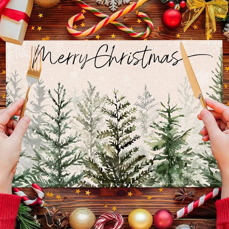 Evergreen tree Linen Christmas Placemat with 'Merry Christmas' script surrounded by festive treats. Adds charm to holiday table settings.