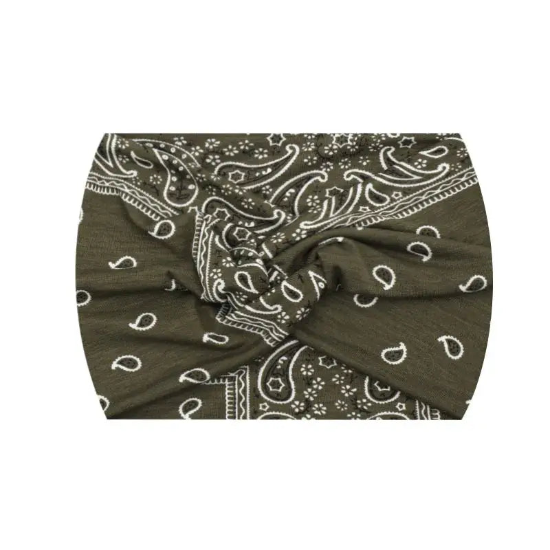 Olive green paisley 18CM stretch printed headband with twist knot. Comfortable and stylish for active or casual wear.