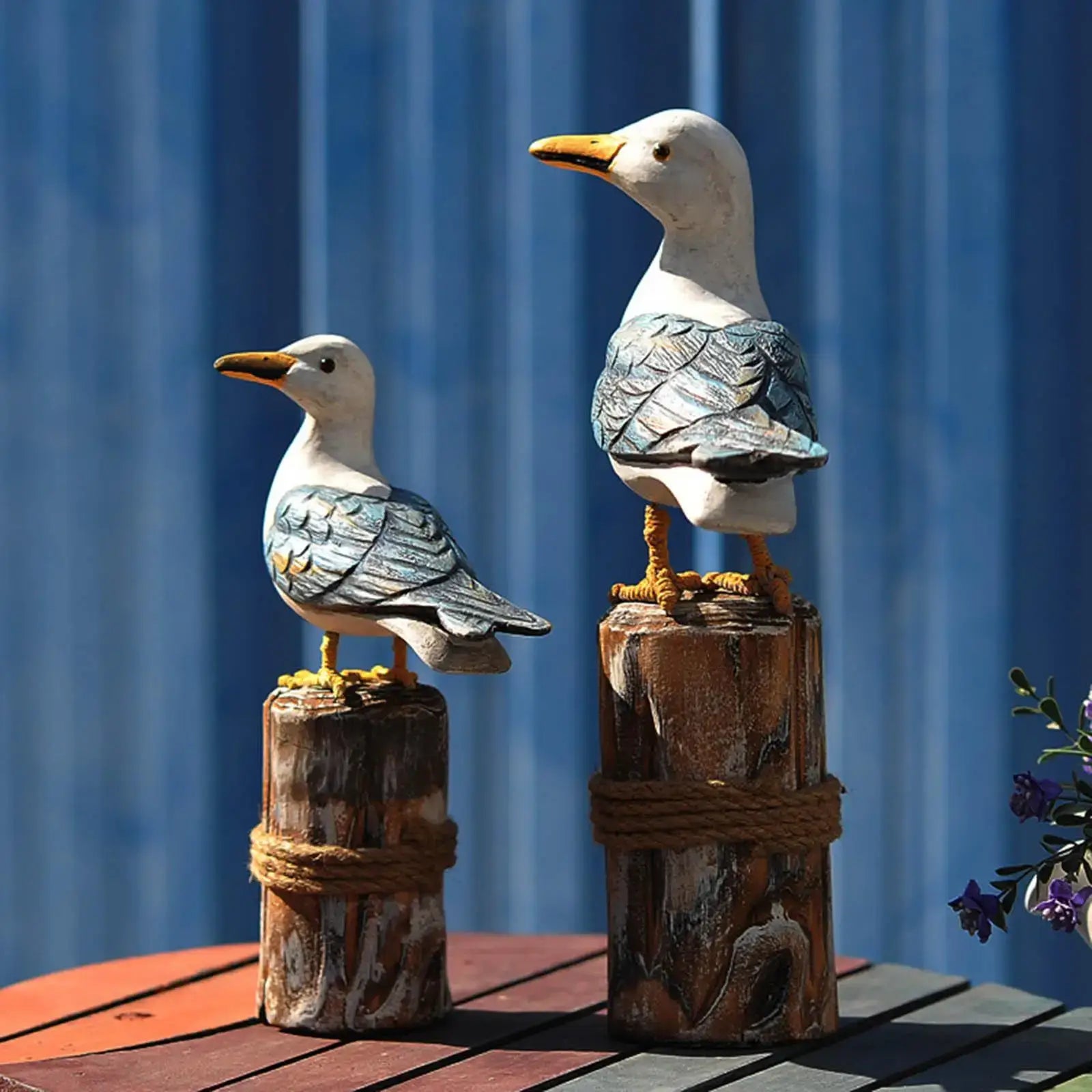 2pcs wooden seagull figurine with nautical rustic design, perched on rope-wrapped wooden posts, ideal for garden or patio decor.