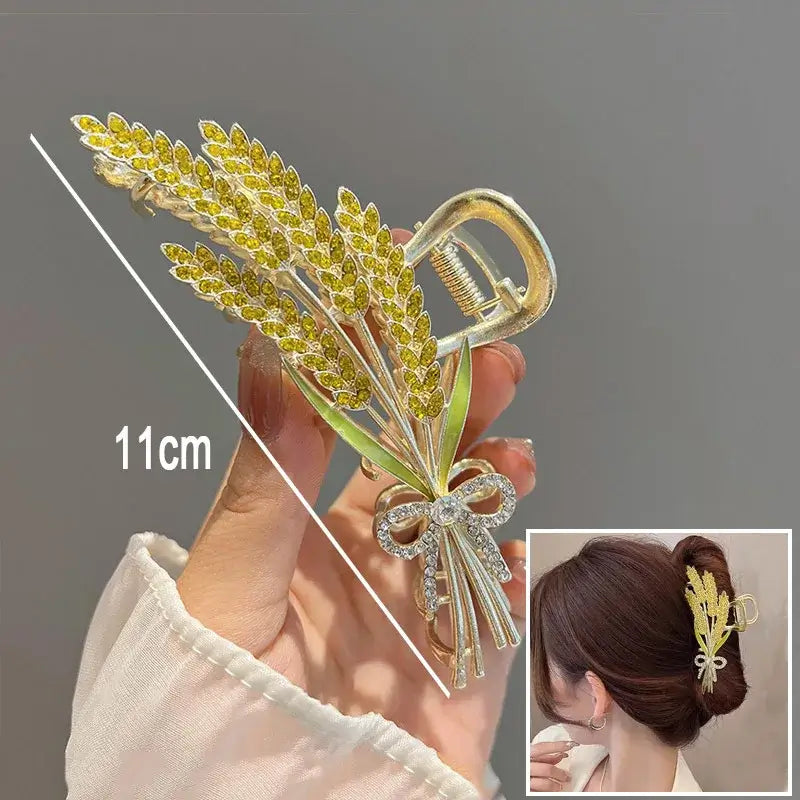Yellow wheat ponytail hair clip with bow detail, 11cm long, designed for strong grip and elegant hair styling.
