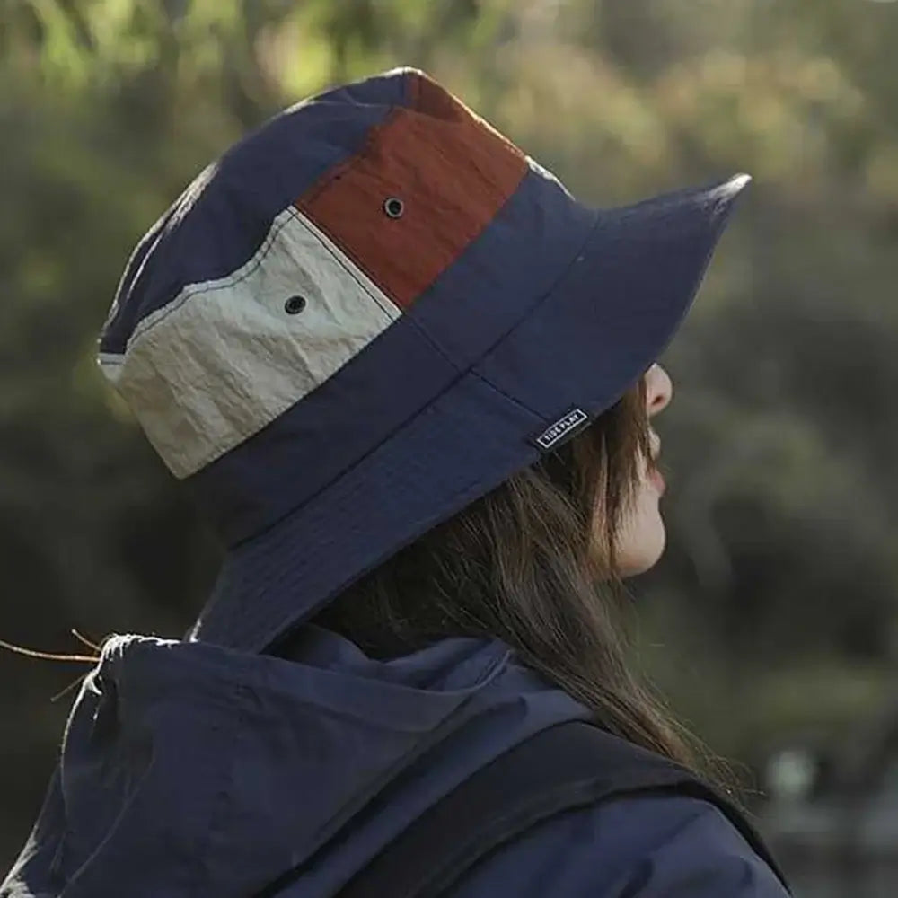 Side view of Sun Protection Bucket Hat - Quick-dry showing breathable eyelets and wide brim. Perfect for sun protection during outdoor activities.