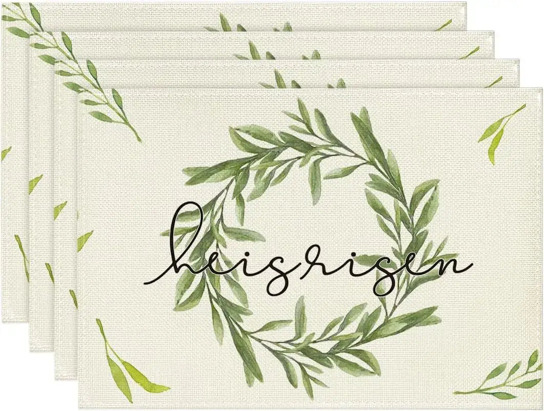 Elegant Easter placemats with green leaf wreath and 'He is risen' script. Perfect for religious-themed spring table settings.