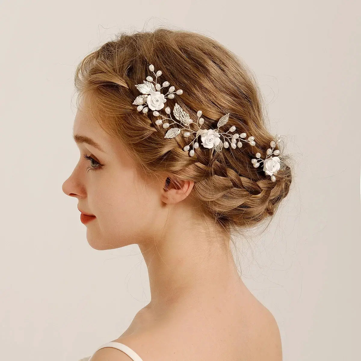 White 3PK Handmade Flower Hair Pin Set styled on braided hair, ideal for bridal looks or formal occasions with elegant floral detail.