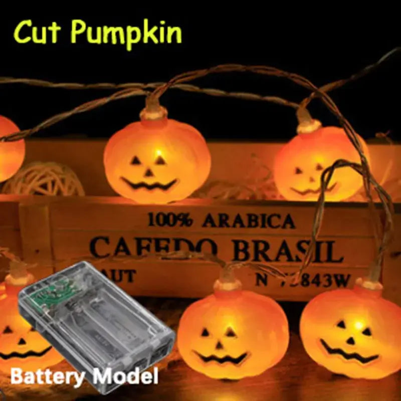 Cut pumpkin LED string lights with battery model. Classic jack-o'-lantern glow for Halloween home decor.