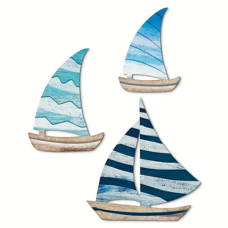 Wooden Sailboat Wall Art Set featuring 3PCS of nautical-themed sailboats in blue tones. Ideal for coastal home decor and beach house accents.