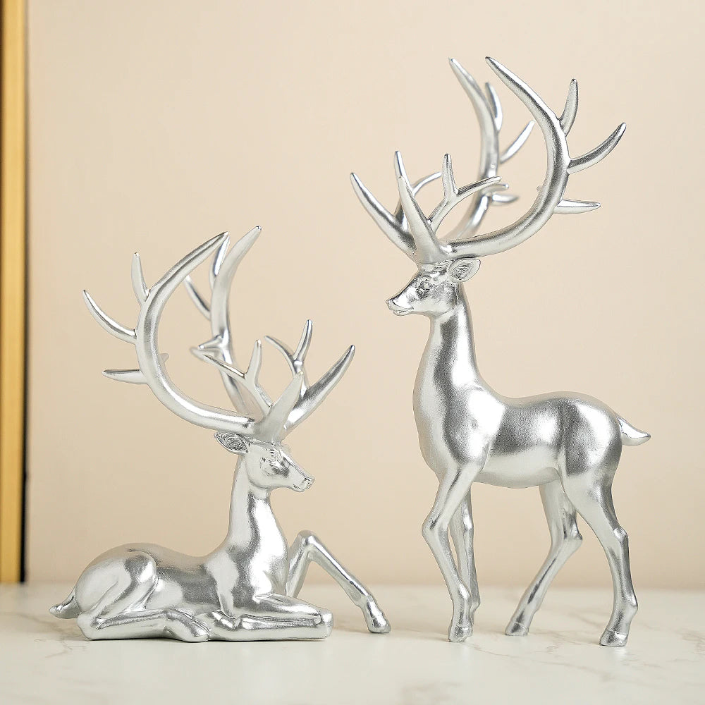 Silver Elk Ornaments Set - Elk Christmas Ornaments in shiny resin. Stylish standing and sitting elk figurines for festive seasonal décor.