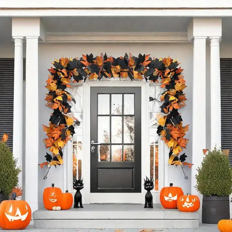 Front porch decorated with Halloween Maple Leaf Garland in orange and black. Enhances entryway with pumpkins and spooky accents.