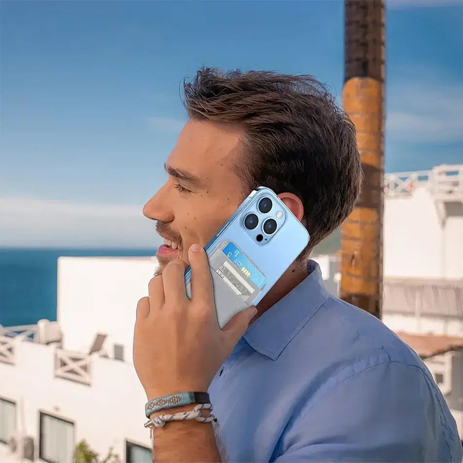 Magnetic Wallets - Cardholder | Slim, Secure, Compatible with iPhone. Man using phone with attached wallet holding cards and cash outdoors.