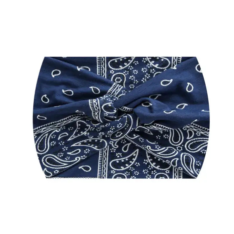 Navy blue paisley 18CM stretch printed headband with white detailing. Great for athletic or casual wear.
