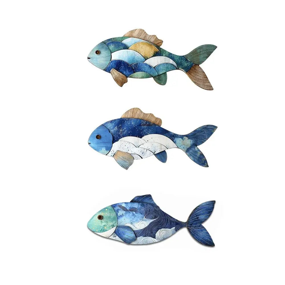 Three wooden fish wall figurines in ocean-inspired colors with wave patterns. Ideal for adding coastal charm to interior spaces.