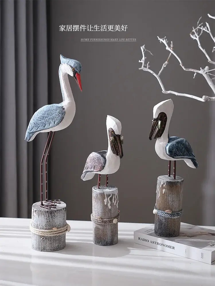 Coastal-themed Mediterranean Resin Seagull Figurines in various sizes on rustic wooden bases, ideal for nautical interior decoration.