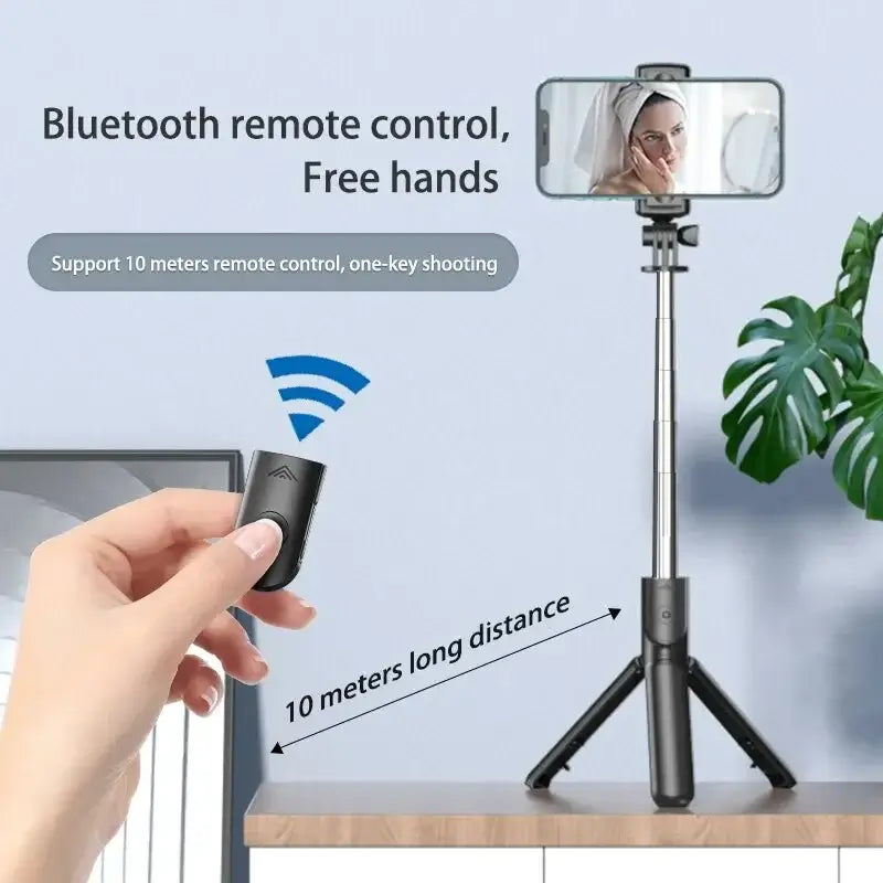 Bluetooth Selfie Stick Tripod with remote control in hand, supporting 10-meter wireless range for one-key shooting convenience.