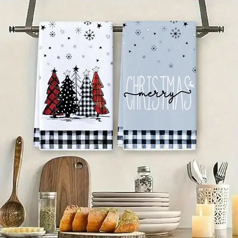 Holiday kitchen towels with gnome, tree, and gift illustrations. Cotton towels with 'Merry Christmas' and 'Holly Jolly' text.