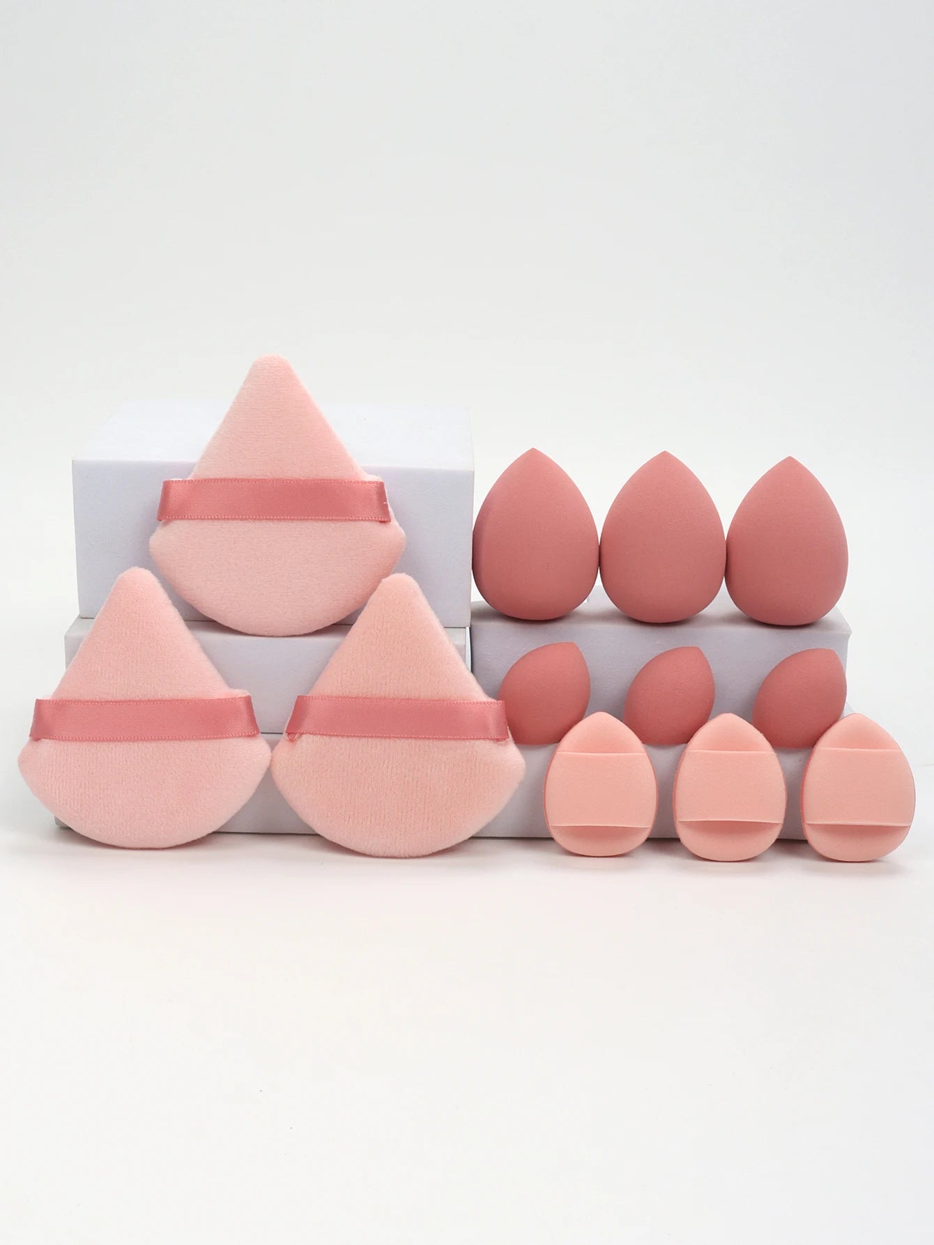 Pink 12-piece makeup sponge set with soft puffs and blending sponges. Perfect for smooth foundation and contour coverage.