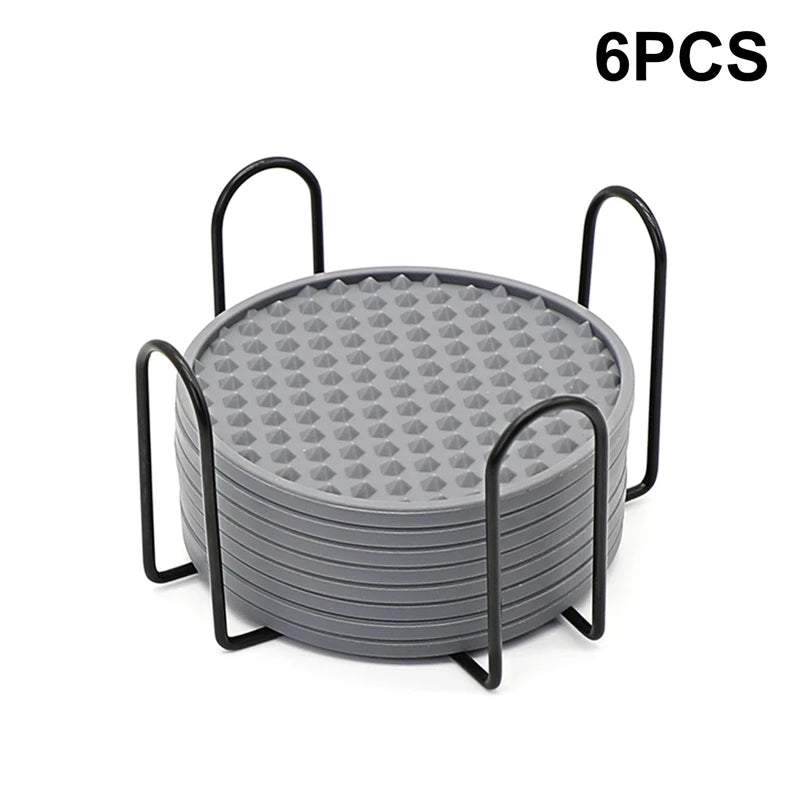 Grey 6Pcs Silicone Coasters Set with metal holder. Modern, durable coasters designed for heat resistance and slip prevention.