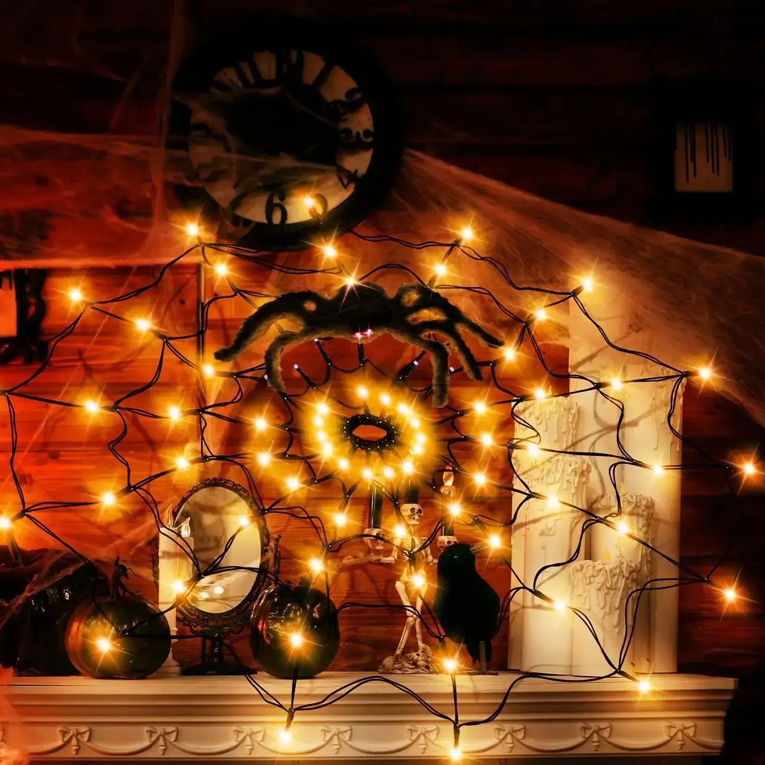 Orange Halloween Ghost LED Light String in spider web shape on a mantel, ideal for festive indoor seasonal decoration.