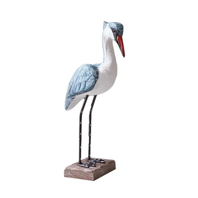 Single Mediterranean Resin Seagull Figurine with blue wings and red beak, standing on a wooden base for beach-style decor.