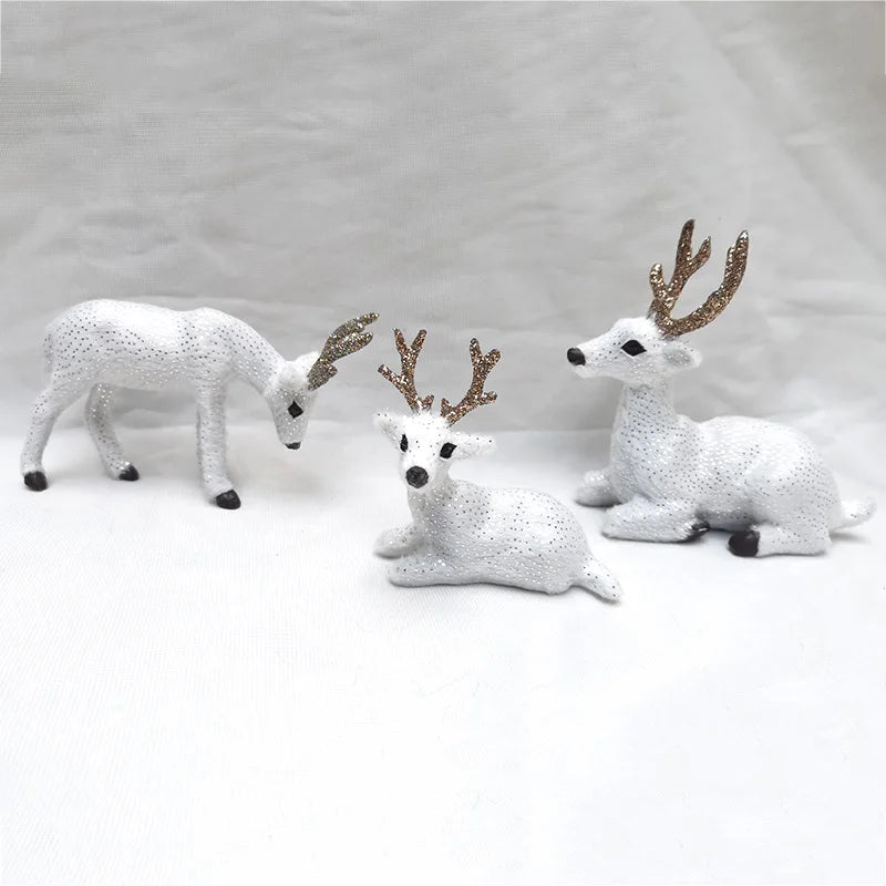 Set of three white Deer Reindeer Figurines - Table Miniatures with gold antlers, great for festive mantle or tabletop displays.