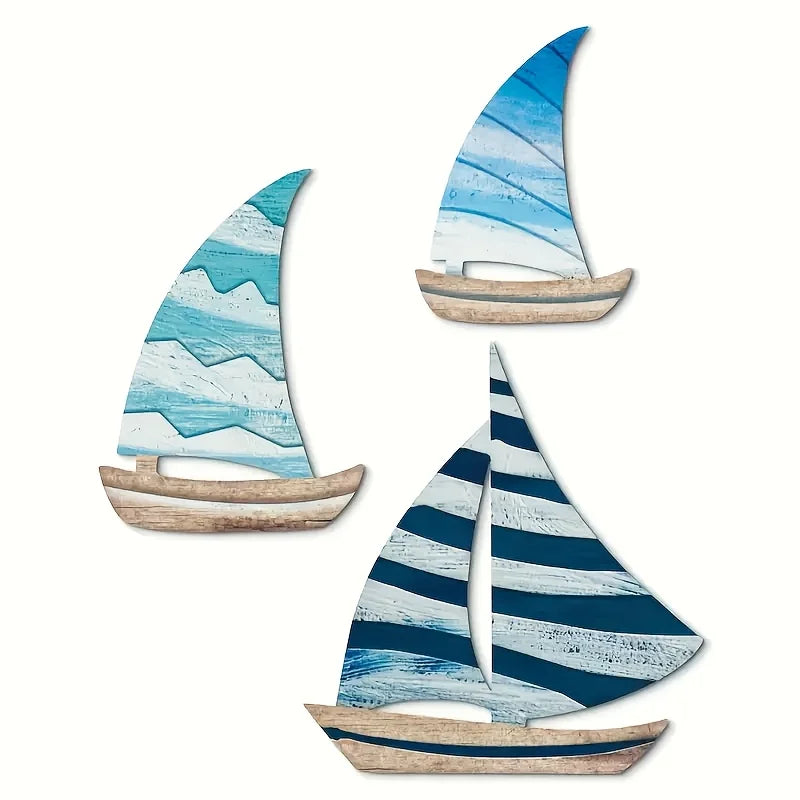 Wooden Sailboat Wall Art Set with three blue-toned sailboats. Ideal for nautical-themed wall decor in home and garden spaces.