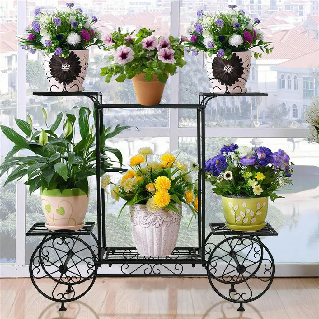 Indoor 6 Tier Garden Cart Plant Holder with floral arrangements in a sunlit room. Durable metal stand enhances plant display and space use.