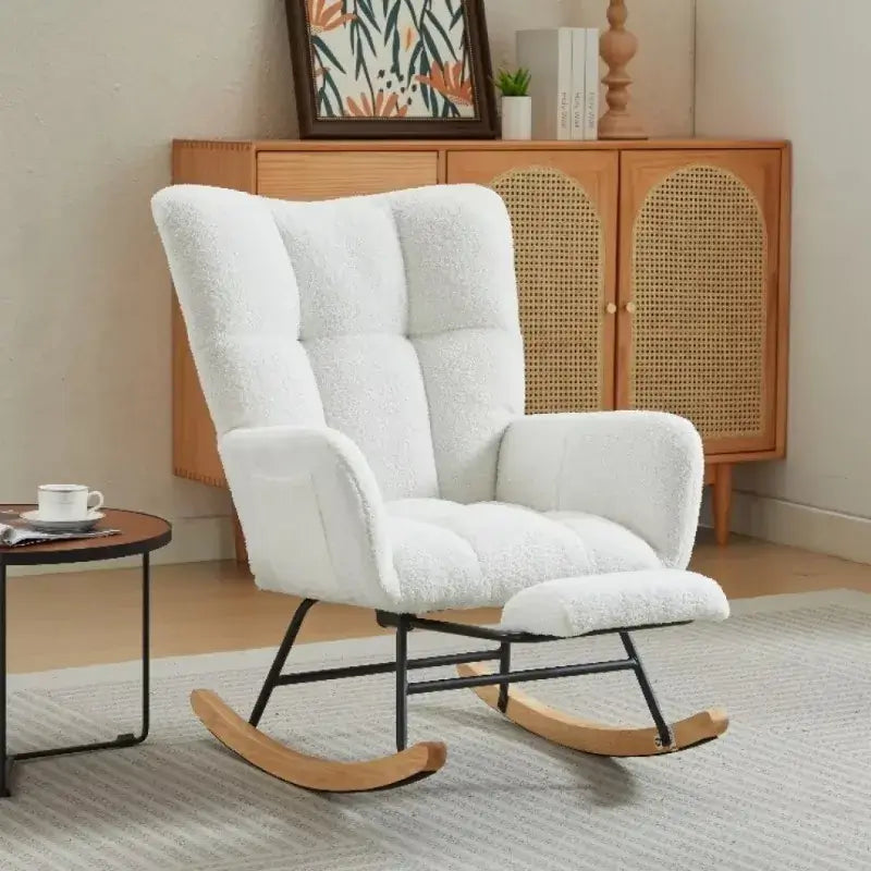 White teddy velvet nursery rocking chair with ergonomic backrest and wooden rocker base, perfect for modern interiors.