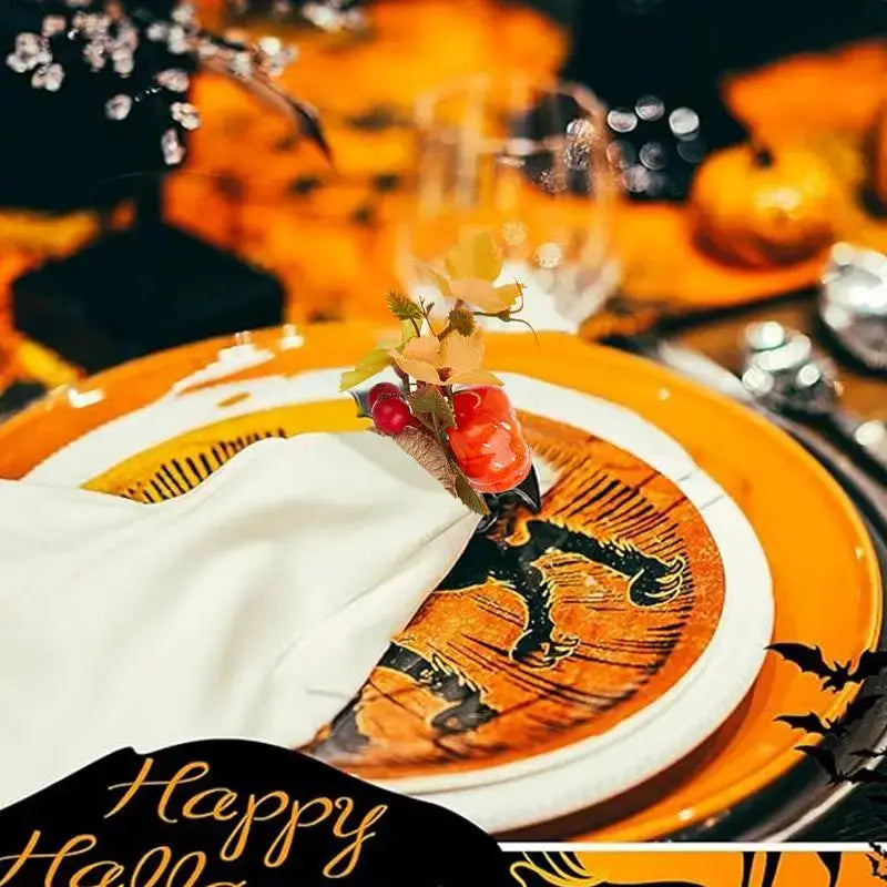 Halloween dinner table setup with a decorative pumpkin napkin ring from the 6-piece set, enhancing the holiday ambiance with autumn accents.